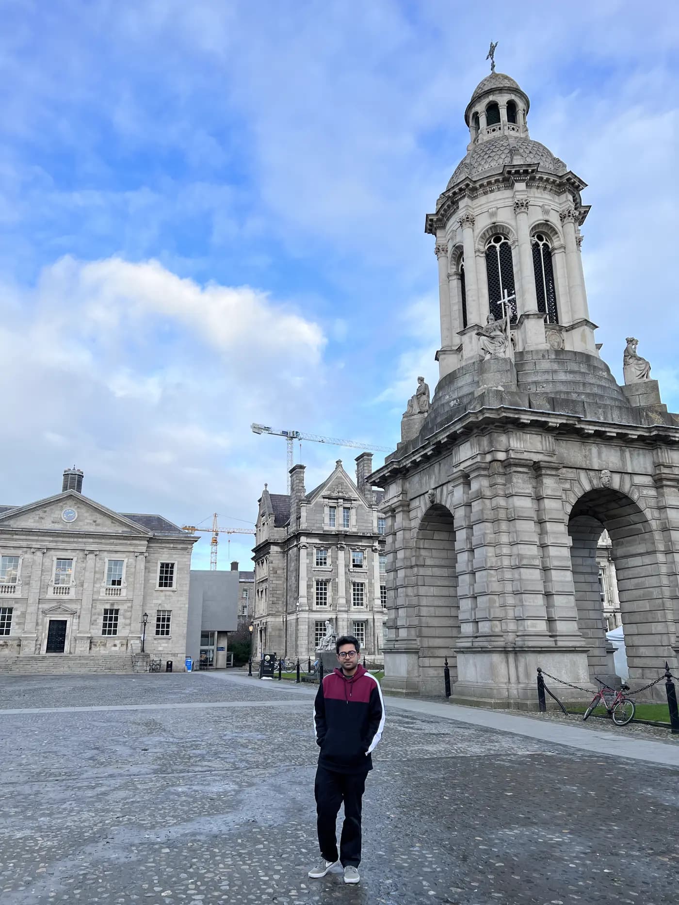 Khalid Farhan in front of the campanile at Trinity College Dublin